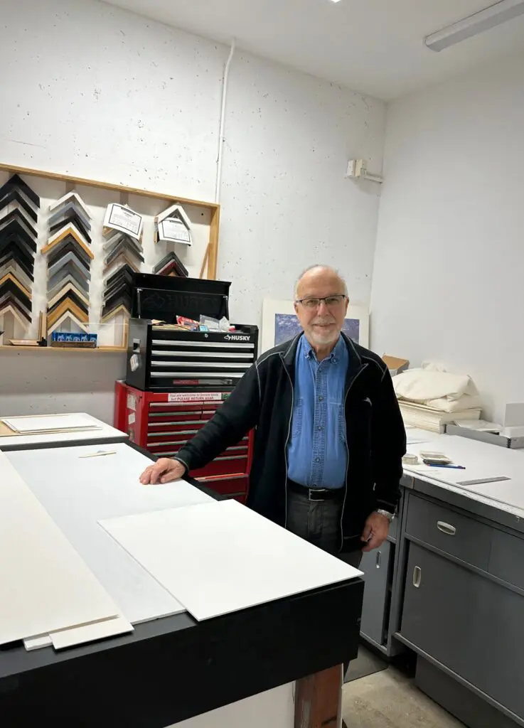 Portrait of Michael Trevillion, Preparation Department staff, in his work space at the Gallery.