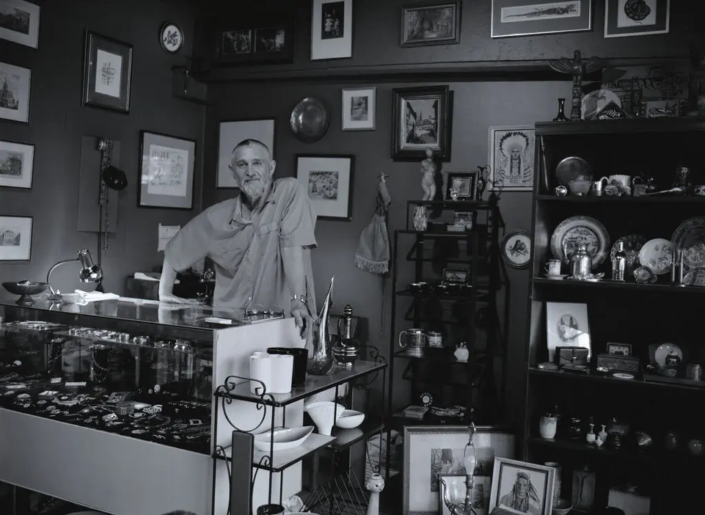 John David Lawrence in his shop in the antique mall, Vancouver, c. 2003, Photo: Donna Hagerman