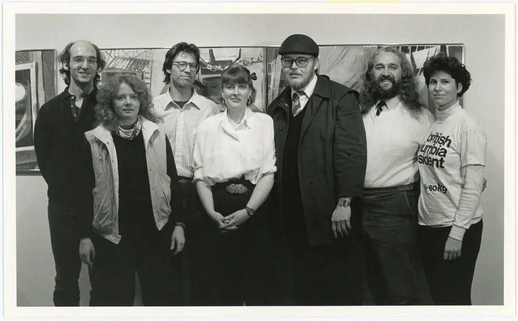 Group photo in black and white of seven men and women