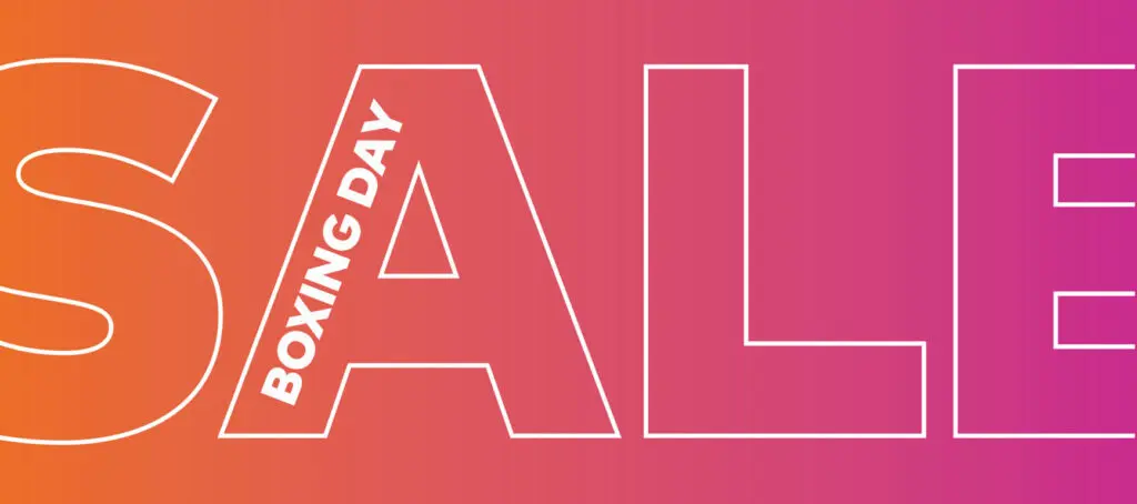 A graphic on an orange and pink gradient that reads SALE in letters outlined in white, with the text "Boxing Day" on an angle inside the letter A.
