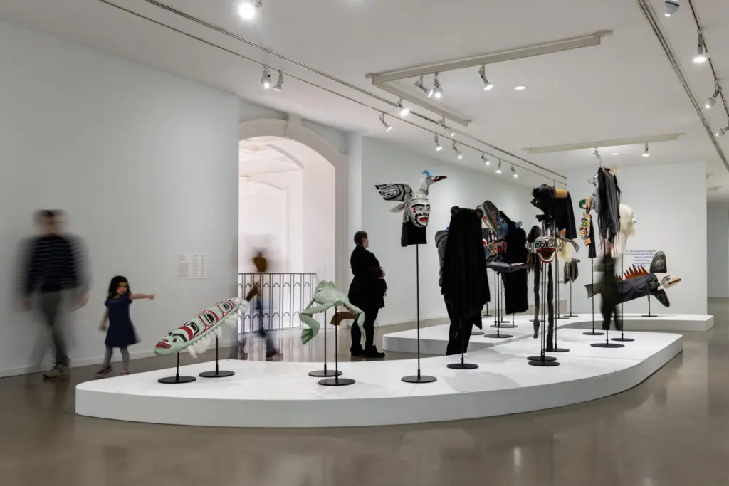 Installation view of Indigenous masks carved by Beau Dick in the exhibition "We who have known tides: Indigenous Art from the Collection."