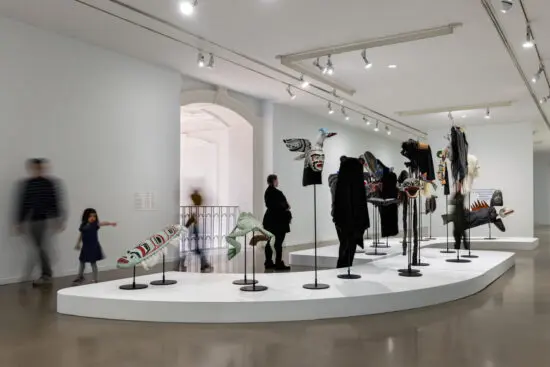 Installation view of Indigenous masks carved by Beau Dick in the exhibition "We who have known tides: Indigenous Art from the Collection."