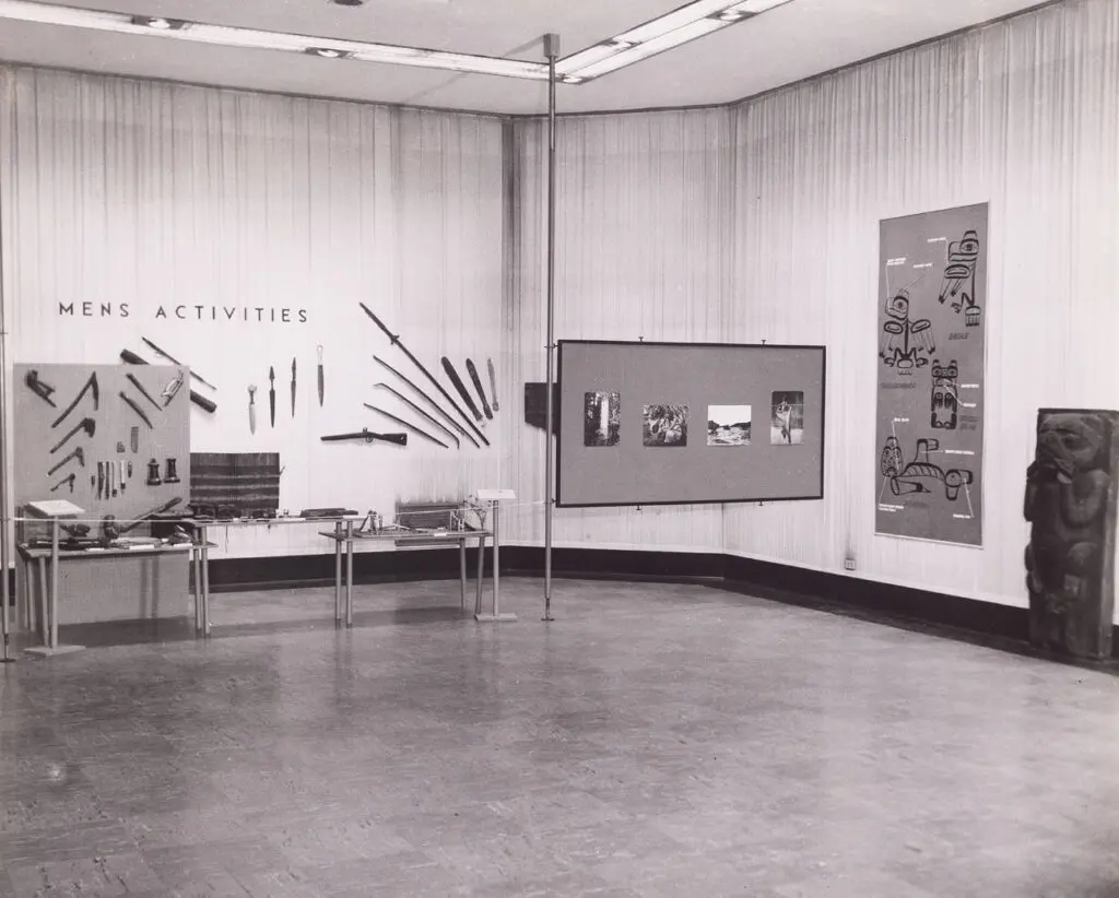 An archival photograph in black and white of an early exhibition of Indigenous art.