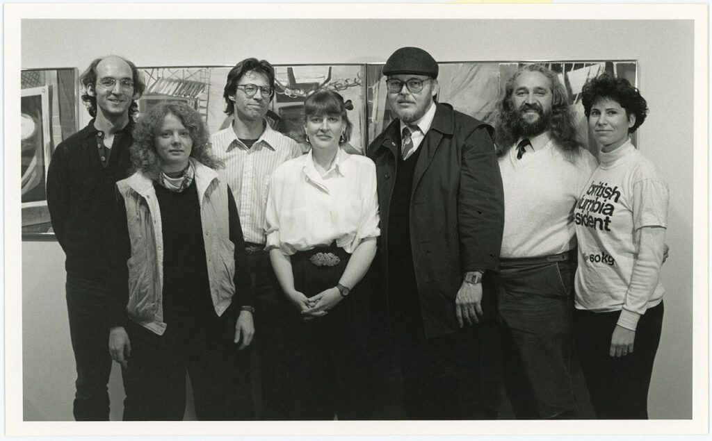 Group photo in black and white of seven men and women