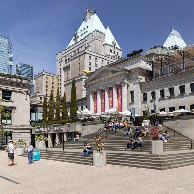 Exterior shot of the Vancouver Art Gallery's Robson Street entrance with the Bistro stairs and people visible in the foreground.